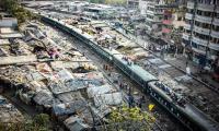 Tejgao slum lies by the rail tracks.